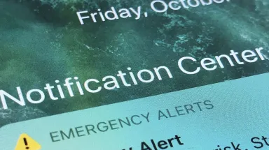 Blockchain emergency alert system in action during a natural disaster