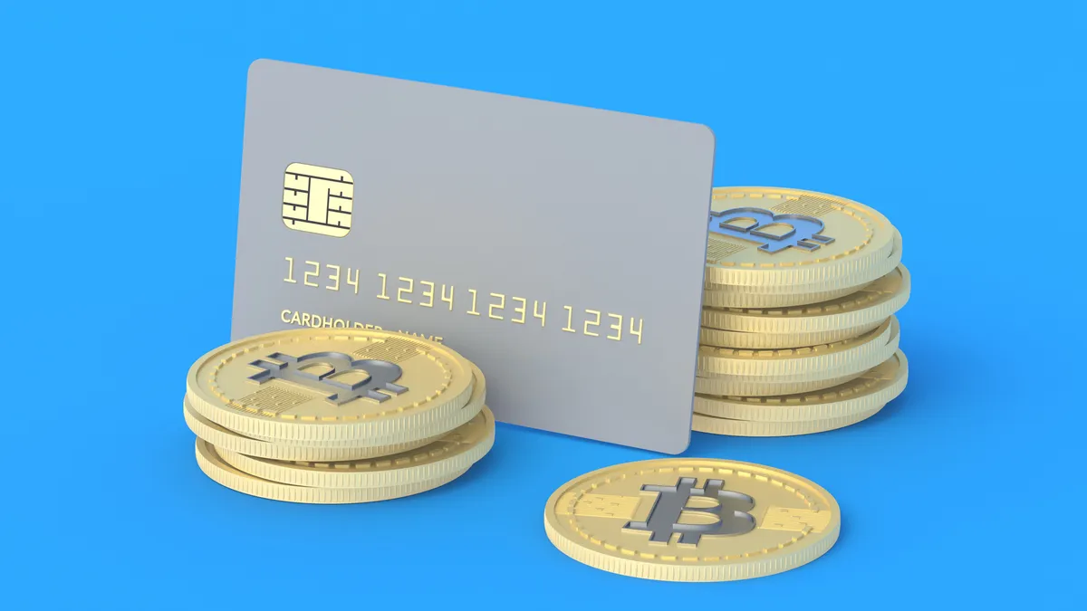 Person using a crypto debit card to pay at a store terminal